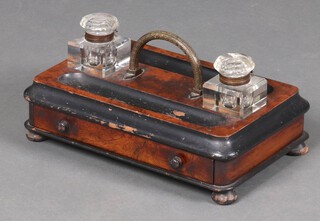 A Victorian rectangular walnut and ebonised 2 bottle standish with gilt handle to the centre and 2 square glass inkwells, the base fitted a drawer, raised on bun feet 18cm h x 36cm w x 22cm d 