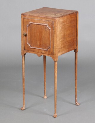 A Georgian style bleached mahogany bedside cabinet enclosed by a panelled door, raised on pad feet 80cm h x 32cm w x 33cm d 
