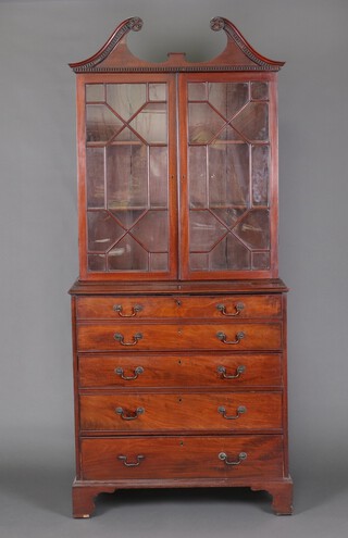 A Georgian mahogany secretaire bookcase with broken pediment, moulded and dentil cornice, fitted adjustable shelves enclosed by astragal glazed panelled doors, the interior fitted pigeon holes above 3 long graduated drawers, raised on bracket feet 224cm h x 97cm w x 86cm d 