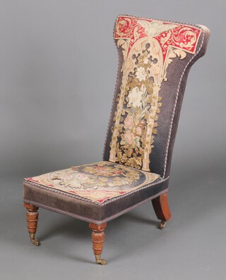A Victorian prie-dieu chair, upholstered in Berlin woolwork with rising dove 92cm h x 81cm x 53cm 
