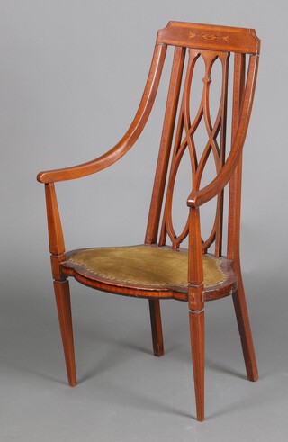 An Edwardian inlaid mahogany Art Nouveau bar back open arm chair with pierced lattice work back, shaped seat, raised on square tapered supports 108cm h x 60cm w x 41cm d (seat 28cm x 26cm), the solid seat marked AT 