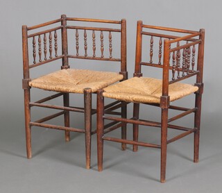 A pair of Edwardian William Morris style beech framed bobbin back corner hall chairs with woven rush seats 70cm h x 40cm w x 30cm d 