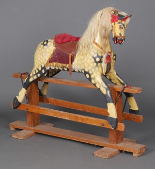 A Collinson mid 20th Century wood carved dapple grey rocking horse with hair mane and tail, on a beech and metal swing base, 127cm h x 151cm w x 48cm w 