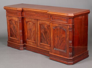 A Victorian mahogany inverted breakfront sideboard fitted a secret drawer above double cupboard enclosed by a panelled door, flanked by 2 secret drawers and cupboard enclosed by panelled doors, 92cm h x 187cm w x 58cm d 