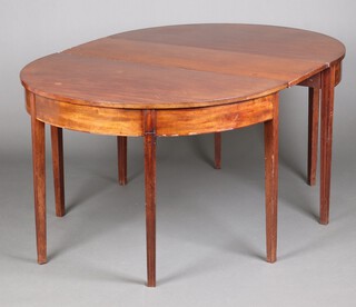 A Georgian mahogany demi-lune dining table, raised on 8 square supports with 1 extra leaf 73cm h x 102cm w x 121cm l with leaf 156cm l  