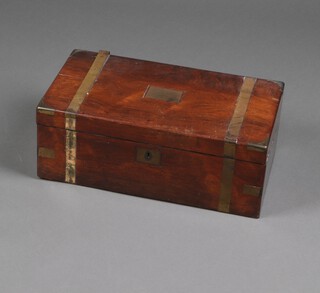 A Victorian mahogany and brass banded writing slope with hinged lid, fitted 2 ink wells, brass plaque to the top inscribed "Presented to the Rev. William Glen by his friends at Marsh Gibbon in grateful remembrance of his Ministry among them September 1862" 18cm x 50cm x 28cm 