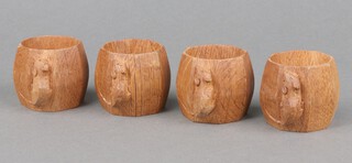 Robert "Mouseman" Thompson of Kilburn,  a set of 4 octagonal oak napkin rings, each with a carved mouse 5cm x 4cm 