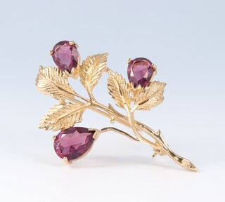 A yellow gold, testing as 9ct, amethyst floral spray brooch 5.5 grams 