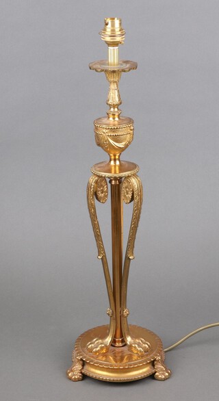 An Adam style gilt metal table lamp surmounted by an urn with swags, on circular base with 3 hoof supports 49cm h x 14cm 