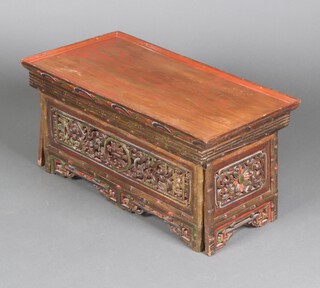 A Chinese rectangular carved and pierced painted folding occasional table 36cm h x 73cm w x 8cm d 