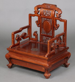 A 20th Century Chinese pierced carved hardwood merchants armchair with pierced splat back, panels carved mythical beasts 70cm h x 56cm w x 43cm d (seat 35cm x 26cm) 