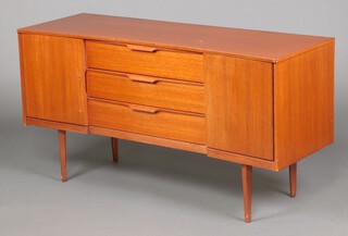 An Austinsuite mid-century teak sideboard, the 3 central long drawers with lip curl handles 69cm h x 131cm w x 44cm d 