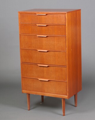 An Austinsuite mid-century teak chest of 6 drawers all fitted lip curl handles, raised on tapering supports 124cm h x 64cm w x 41cm d 