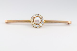 A 9ct yellow gold moonstone and diamond cluster bar brooch, the moonstone 2ct, the 11 brilliant cut diamonds 1.6ct, 75mm, 7.8 grams 