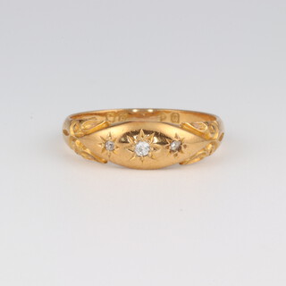 An 18ct yellow gold 3 stone diamond set ring, approx 0.5ct, size Q, 3.8 grams
