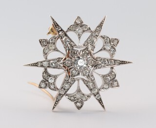 A Victorian 9ct yellow gold diamond star brooch, 37mm, approx. 1.75ct, 8.4 grams 