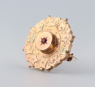 A Victorian 9ct 2 colour gold garnet set brooch, 30mm, 4.7 grams 