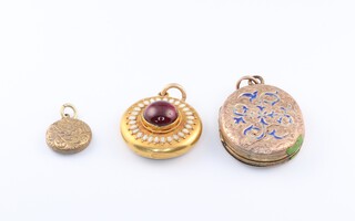 An Edwardian yellow gold, testing as 14ct, enamelled and cabochon garnet pendant with hair back (1 gold dot is missing), 20mm, 4.8 grams gross, together with 2 gilt lockets 