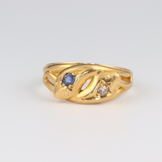 An 18ct yellow gold sapphire and diamond snake ring, the diamonds 0.03ct, the sapphire 0.05ct, size P, 3.8 grams  