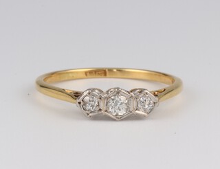 An 18ct yellow gold illusion set 3 stone diamond ring 0.18ct, size Q, 2.3 grams 