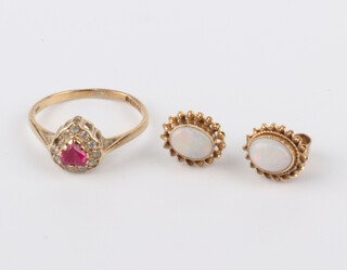 A 9ct yellow gold heart shaped ruby and diamond ring, size K 1/2 and a pair of opal ear studs, 2.6 grams