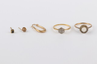 An 18ct yellow gold 7 stone diamond ring approx. 0.03ct, size M, 1.6 grams and a 9ct pasted set ditto size M, 1.9 grams together with 2 studs and an ear clip, gross weight 4.6 grams 