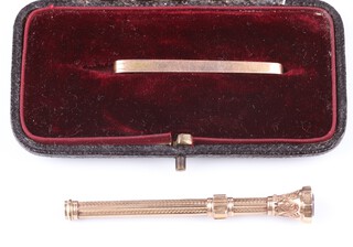 A 9ct yellow gold bar brooch 1.6 grams and a 9ct yellow gold amethyst set tooth pick, gross weight 4.5 grams 