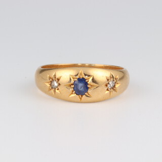 An 18ct yellow gold sapphire and diamond ring, the sapphire 0.15ct, the 2 diamonds 0.03ct, size P, 5.2 grams 