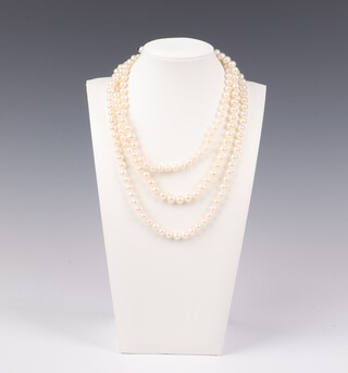 A triple strand of double knotted cultured pearls with silver clasp 46cm 