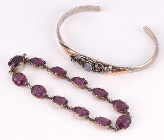 A silver and amethyst bracelet and a silver and gold embellished opal set bangle, gross weight 29.9 grams