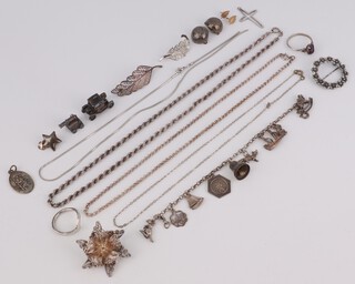 A silver charm bracelet and other items of silver costume jewellery 64 grams
