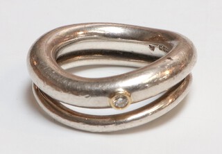 A 925 standard silver double wedding band set with a brilliant cut diamond 0.03ct, 12.5 grams, size K 1/2