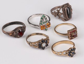 Two 9ct yellow gold sapphire set rings, sizes K and N, 3.7 grams together with 4 silver rings sizes M, M, O and O