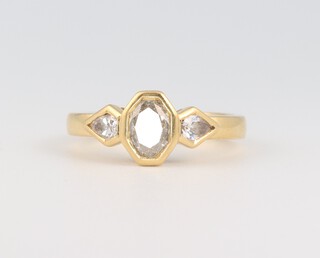 A 14ct yellow gold diamond ring, the centre oval 0.50ct and the 2 pear shaped diamonds 0.20ct, size J, 4.2 grams 