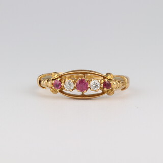 An 18ct yellow gold ruby and diamond ring, the diamonds 0.06ct, the rubies 0.10ct, size Q, 3.3 grams