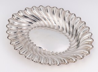 A Victorian repousse silver shallow dish, Sheffield 1886, 27cm, 284 grams 