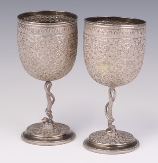 A pair of Indian repousse silver goblets with snake stems and circular bases 16cm, 362 grams 
