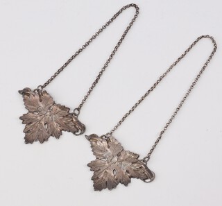 A pair of cast and pierced Victorian silver spirt labels - Gin and Rum, maker George Unite, Birmingham 1842, 5cm 