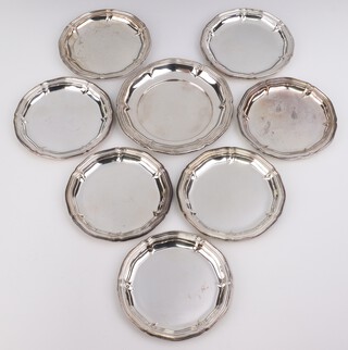 A set of 7 Continental silver 835 coasters, 10.5cm and a ditto 12cm, 308 grams