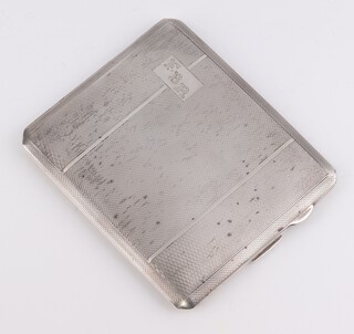 An Art Deco silver engine turned cigarette case with engraved monogram and inscription, 10cm x 8.5cm, Birmingham 1937, 116 grams 