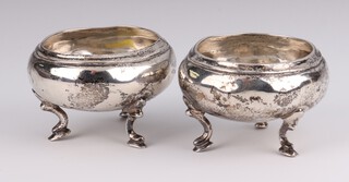 A pair of Russian silver circular table salts, numbered 84, 6cm, 94 grams