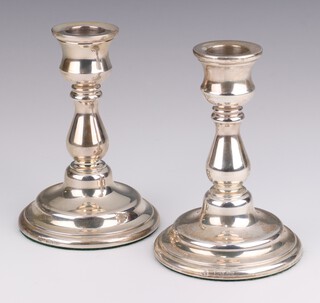 A pair of silver baluster dwarf candlesticks, London 1977, 12cm 
