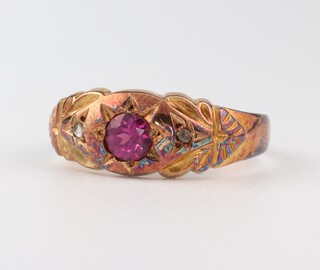 An 18ct yellow gold ruby and diamond ring, the ruby 0.25ct, the diamonds 0.01ct, size Q, 2.7 grams
