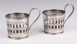 A pair of pierced silver cup holders London 1920, 172 grams 