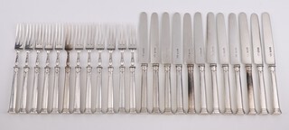 A set of 12 silver dessert eaters, London 1857, gross weight 1034 grams including loaded handles 