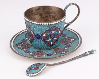 A Russian silver and enamel tea cup, saucer and spoon with pale blue ground and scrolling red, blue and dark blue and white flowers, marked 1896 84 GK, the spoon marked 84 AA 