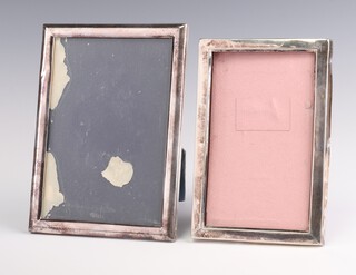 A Continental 835 standard silver rectangular photo frame 15cm x 10cm and a ditto 16cm x 12cm 