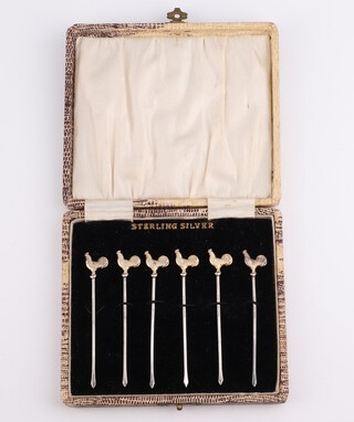 A set of 6 silver and gilt cocktail sticks with cockerel terminals 