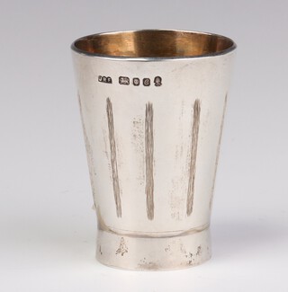 A silver tapered engraved tot with gilt interior London 1977, maker Christian St John Ltd., 6cm, 96 grams 