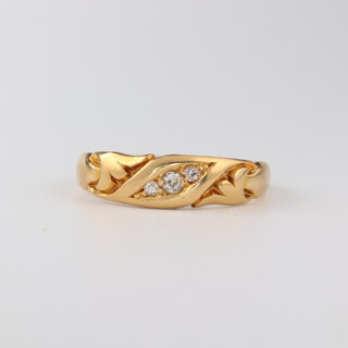 An 18ct yellow gold 3 stone diamond ring 0.05ct, size T 1/2, 3.6  grams